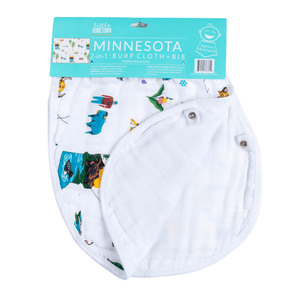 Baby wearing a Minnesota-themed bib and burp cloth set, featuring state icons and landmarks with snaps shown