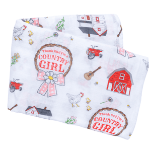 Country Girl muslin swaddle blanket with a floral pattern, featuring pink roses and green leaves on a white background.