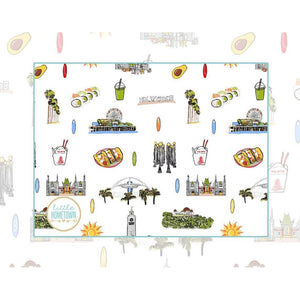 Los Angeles-themed baby bib and burp cloth set featuring iconic city landmarks in vibrant, playful illustrations.
