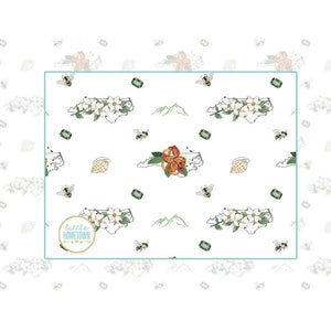 Baby bib and burp cloth set with North Carolina floral design, featuring vibrant flowers and state outline.