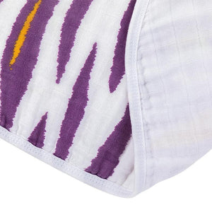 Baby bib and burp cloth set with playful tiger stripe pattern in orange, black, and white on soft fabric.