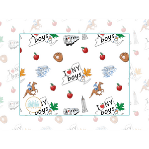Baby burp cloth and wraparound bib set with New York-themed illustrations, including taxis and skyscrapers.