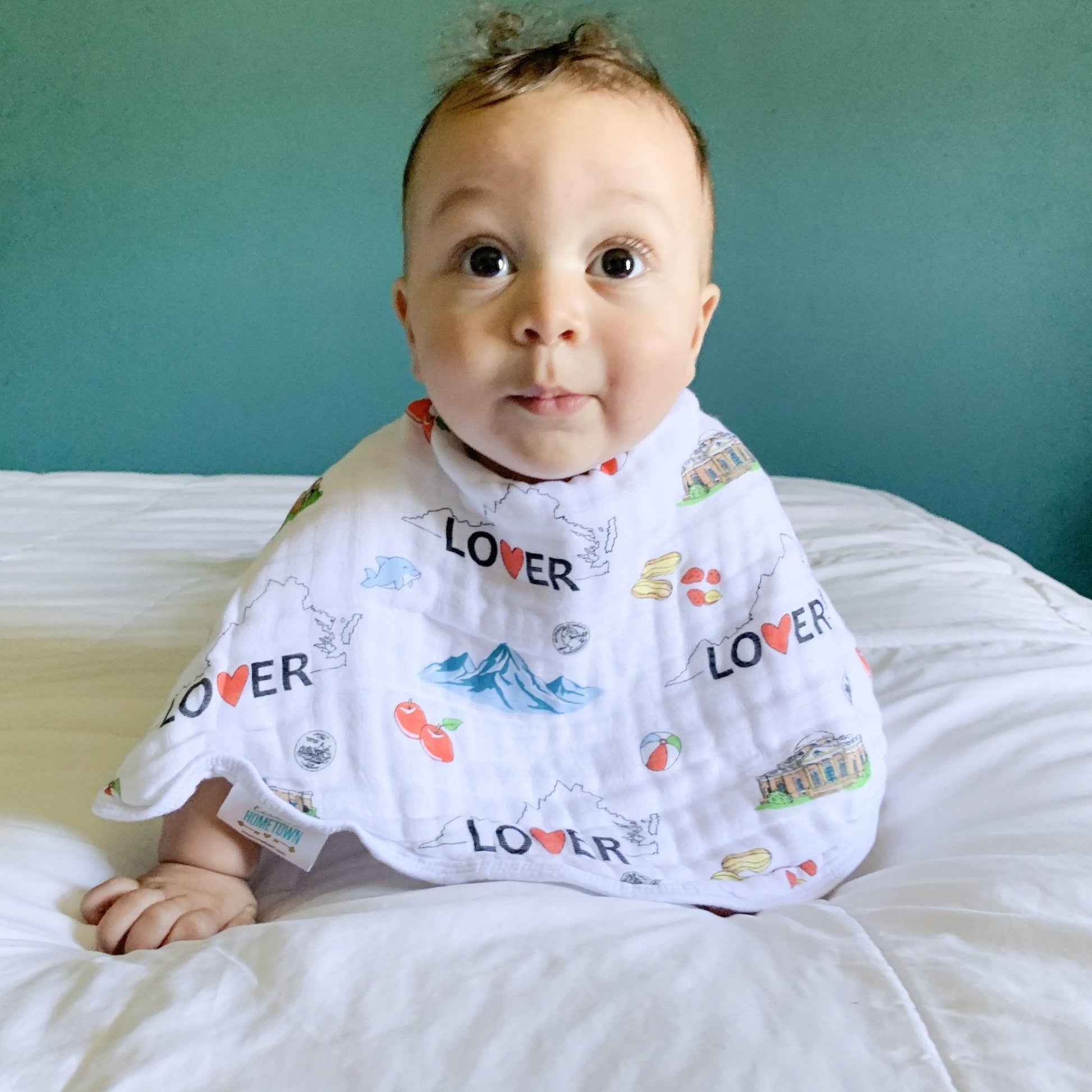 Baby burp cloth and wraparound bib set with Virginia state map design, featuring landmarks and icons.