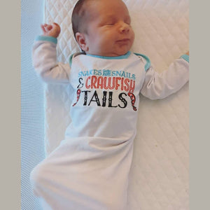 Baby gown for 0-3 months with "Snakes and Snails and Crawfish Tails" print, featuring playful crawfish illustrations.