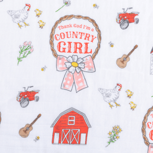 White muslin swaddle blanket with pink floral design and "Country Girl" text in elegant script font.