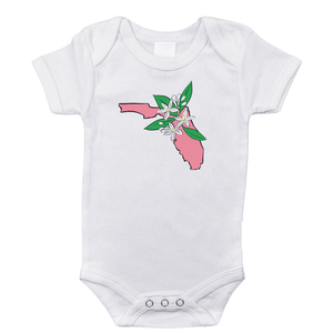 White baby onesie with "Florida Orange Blossom" text and orange blossom graphic, on a plain background.