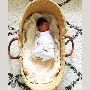 Baby gift set with oyster-themed muslin swaddle blanket and burp cloth/bib combo, featuring cute oyster illustrations.