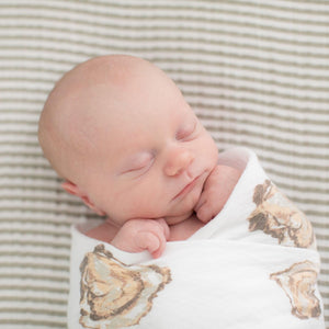 Baby gift set featuring an oyster-themed muslin swaddle blanket and burp cloth/bib combo, with "Aw Shucks!" text.