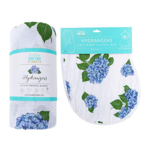 Hydrangea-themed baby muslin swaddle blanket and burp cloth set, featuring soft pastel colors and floral patterns.