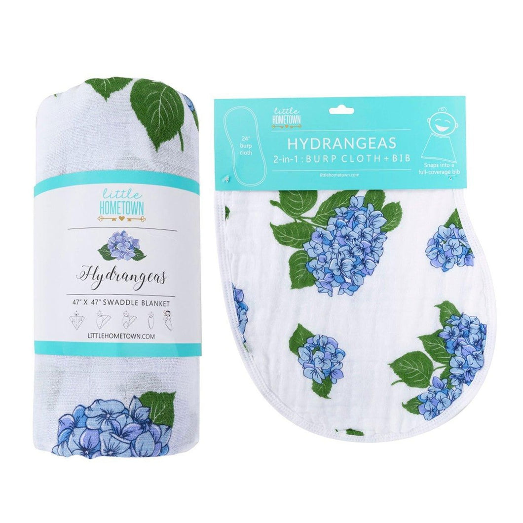 Hydrangea-themed baby muslin swaddle blanket and burp cloth set, featuring soft pastel colors and floral patterns.