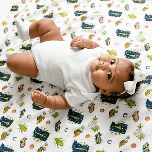 Indiana-themed baby gift set with muslin swaddle blanket and burp cloth/bib combo, featuring state icons.