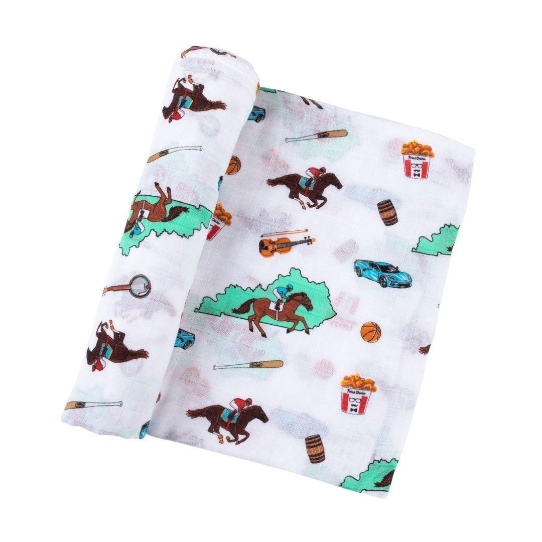 Kentucky-themed baby gift set with muslin swaddle blanket and burp cloth, featuring state icons and landmarks.