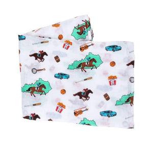 Kentucky-themed baby gift set with muslin swaddle blanket and burp cloth, featuring state icons and landmarks.