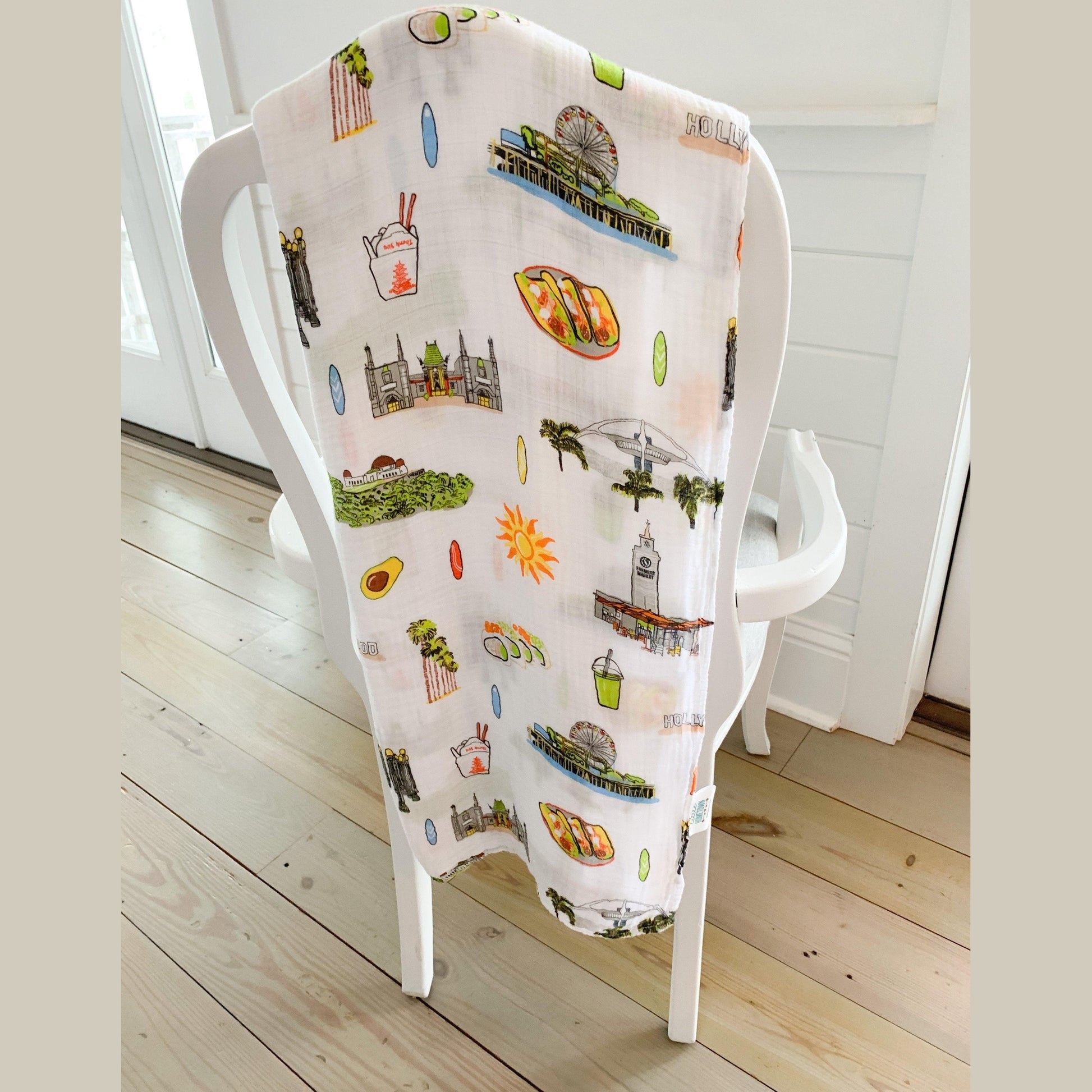 Los Angeles-themed baby gift set with muslin swaddle blanket and burp cloth, featuring iconic city landmarks.
