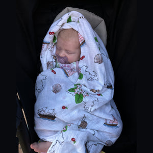 Massachusetts-themed baby swaddle and burp cloth set with floral design, featuring state map and landmarks.