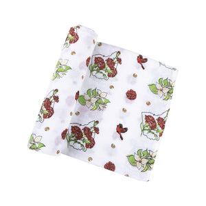 Ohio-themed baby gift set with floral muslin swaddle, receiving blanket, and burp bib, all neatly arranged.