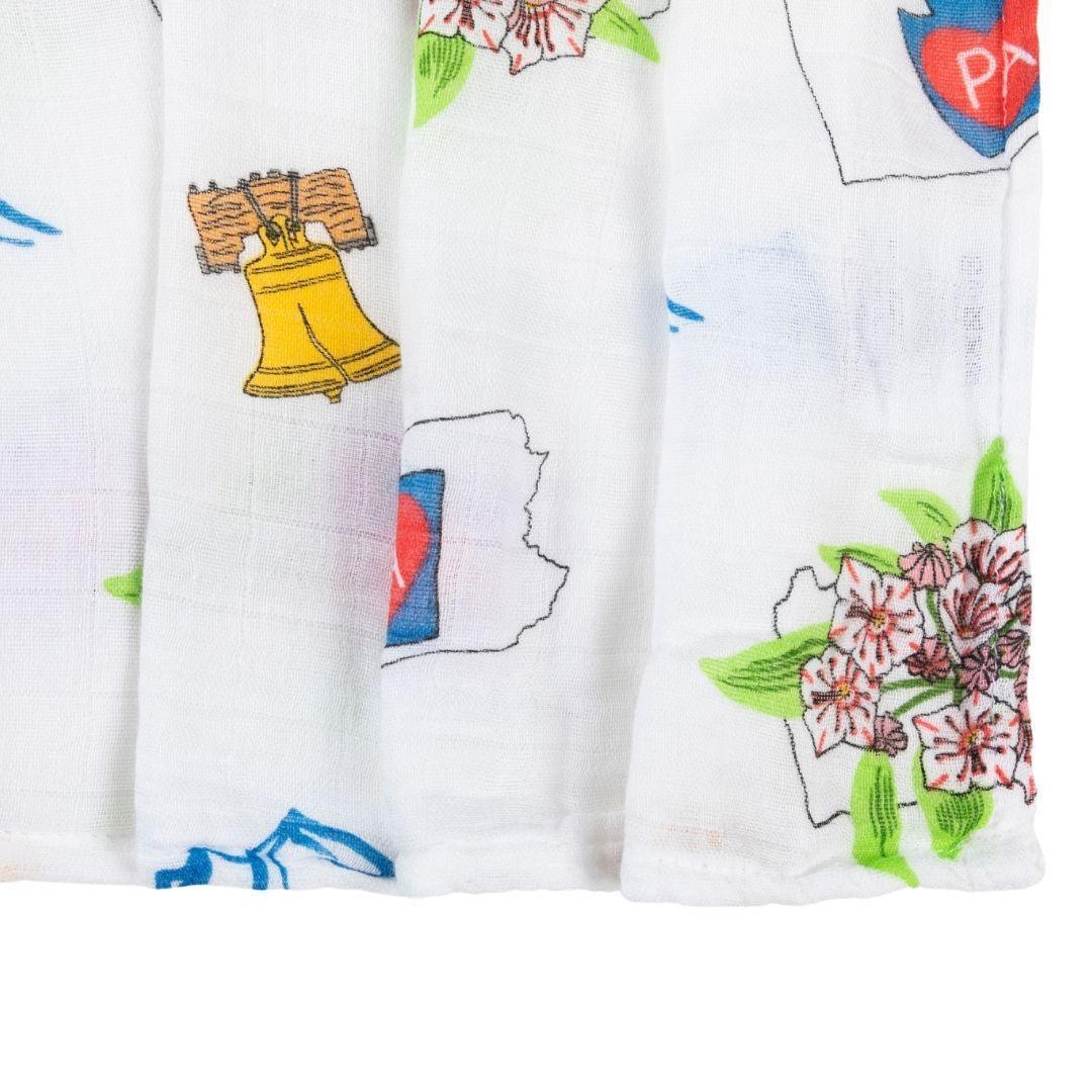 Pennsylvania-themed baby gift set with muslin swaddle blanket and burp cloth/bib combo, featuring state icons.