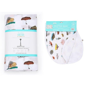 Seattle-themed baby gift set with muslin swaddle blanket and burp cloth/bib combo, featuring iconic city landmarks.