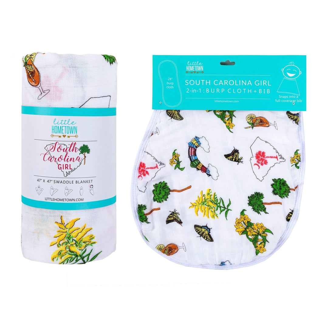 South Carolina-themed baby gift set with muslin swaddle blanket and burp cloth, featuring state icons and text.