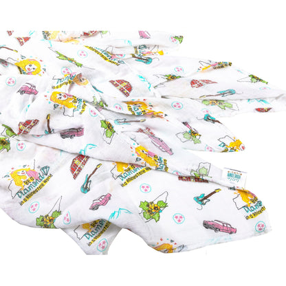 Floral-themed muslin swaddle blanket and burp cloth set with "Tennessee Baby" text, neatly folded on a white background.
