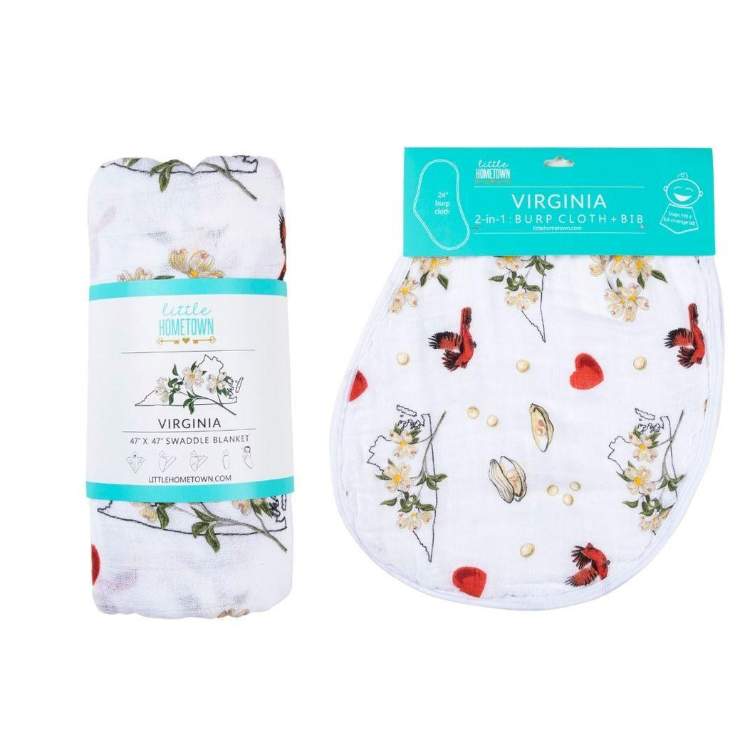 Floral-patterned muslin swaddle blanket and burp cloth set, neatly folded, with 