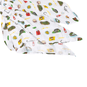 Pittsburgh-themed baby gift set with muslin swaddle blanket and burp cloth, featuring city icons and landmarks.