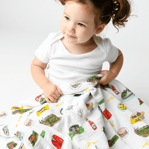 Pittsburgh-themed baby gift set with a muslin swaddle blanket and burp cloth, featuring city landmarks and icons.