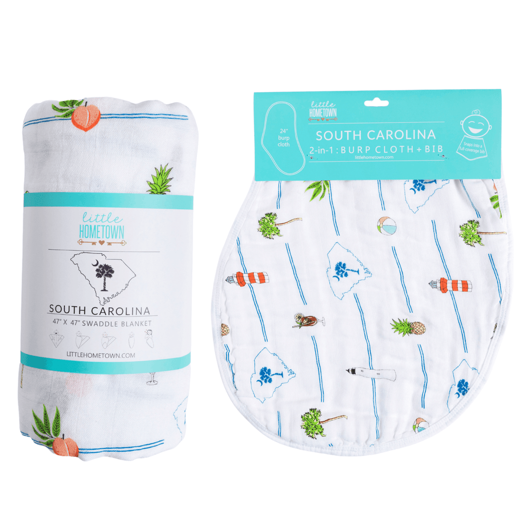 South Carolina-themed baby gift set with muslin swaddle blanket and burp cloth, featuring state icons and landmarks.