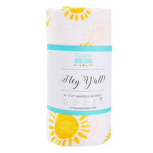 White muslin swaddle blanket with "Hey Y'all" text in playful script, featuring a light blue and white striped background.
