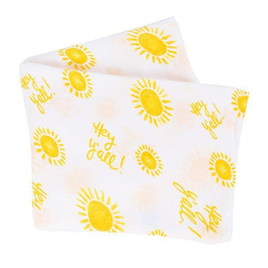 White muslin swaddle blanket with "Hey Y'all" text in playful script, featuring blue and yellow accents.