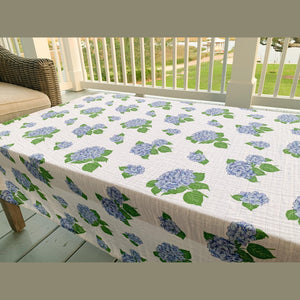 Soft baby muslin swaddle blanket with delicate hydrangea print in pastel blues and greens, by Little Hometown.