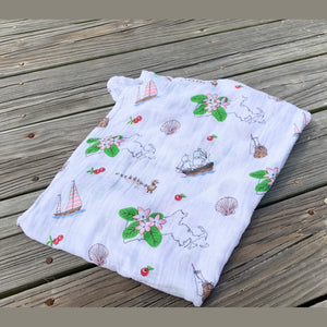 Massachusetts-themed floral muslin swaddle blanket with vibrant pink, blue, and yellow flowers on a white background.