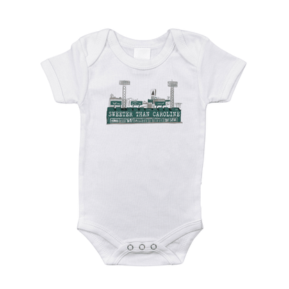 White baby onesie with "Massachusetts Sweeter Than Caroline" text and a red heart, on a plain background.