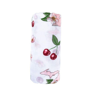White muslin swaddle blanket with colorful floral patterns and "Michigan" text, laid flat on a white background.