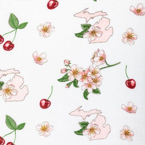 White muslin swaddle blanket with colorful floral patterns and "Michigan Baby" text, laid flat on a white background.