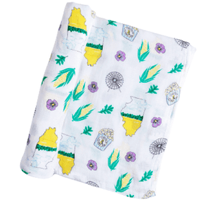 White muslin baby blanket with Illinois state map, featuring landmarks, animals, and "Illinois" text in blue.