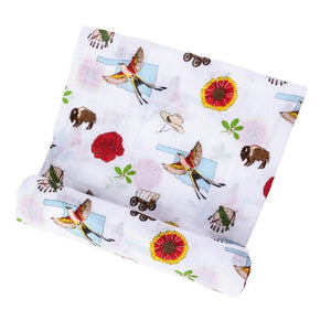 Oklahoma-themed baby swaddle blanket with state icons and landmarks in soft pastel colors on a white background.