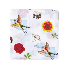 Baby swaddle blanket with Oklahoma map design, featuring landmarks, animals, and state symbols in soft pastel colors.