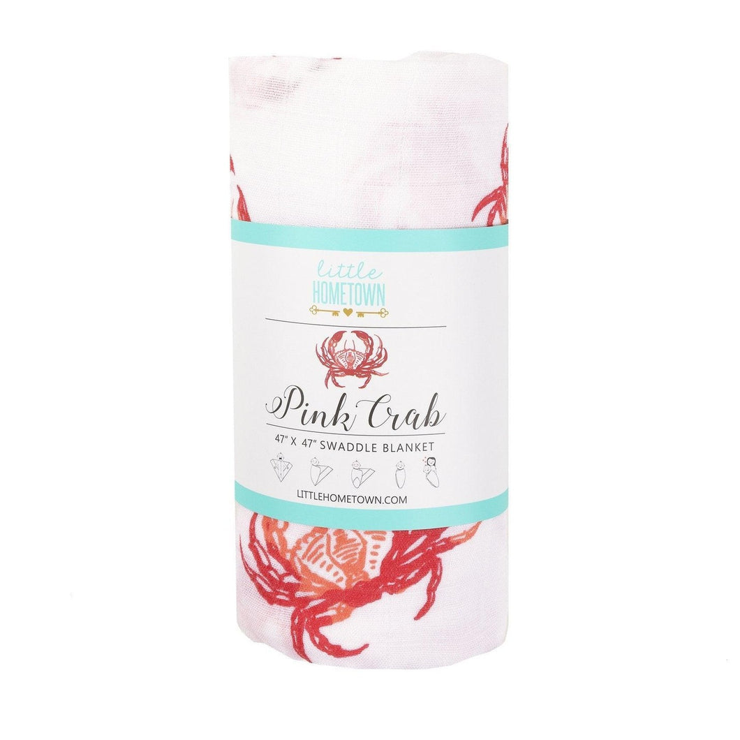Soft pink muslin swaddle blanket with cute crab illustrations, perfect for newborns and baby showers.