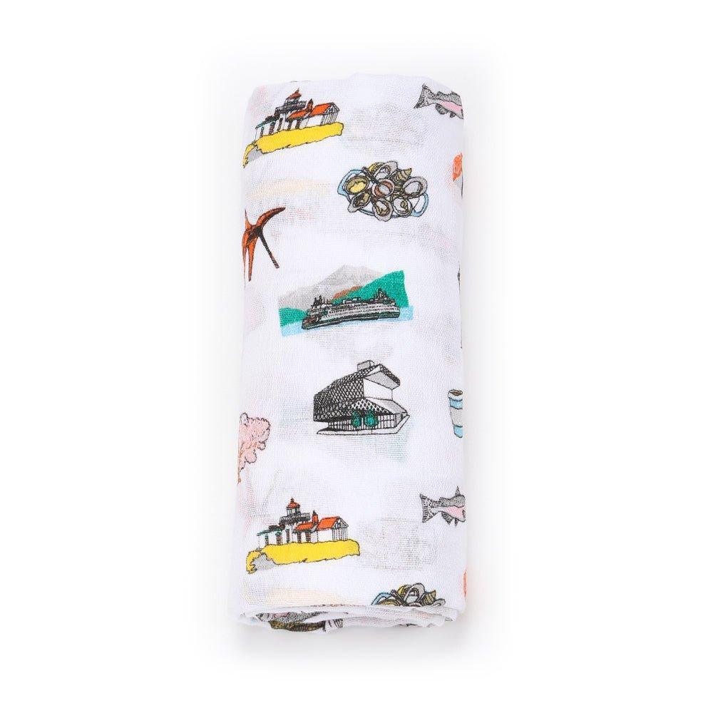 Seattle-themed baby muslin swaddle blanket with iconic landmarks in soft pastel colors on a white background.