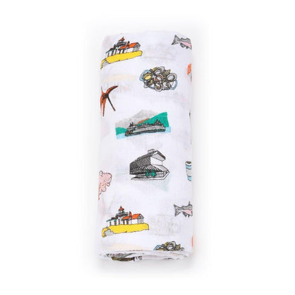 Seattle-themed baby muslin swaddle blanket with iconic landmarks in soft pastel colors on a white background.