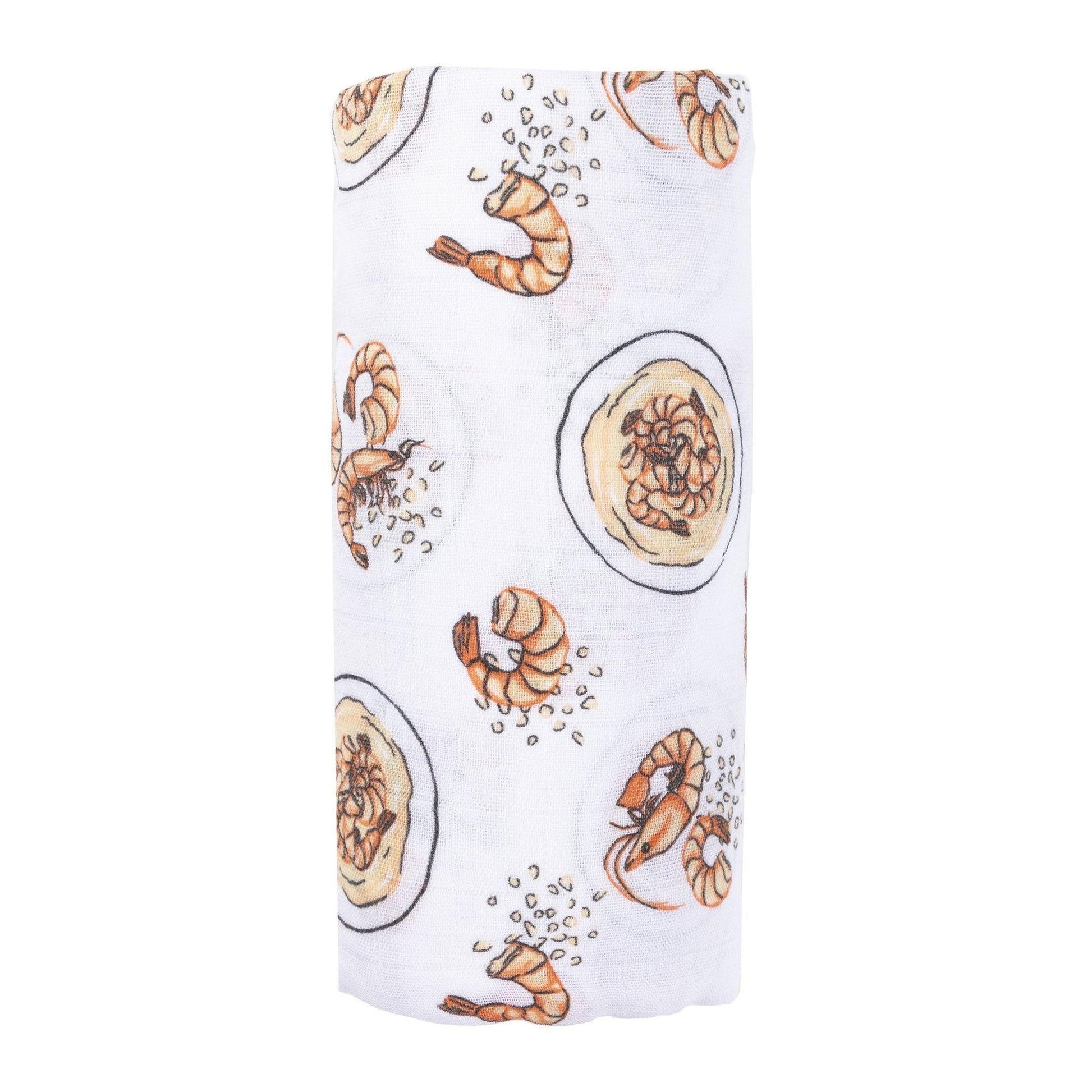 White muslin swaddle blanket with colorful shrimp and grits pattern, featuring bowls, shrimp, and corn.