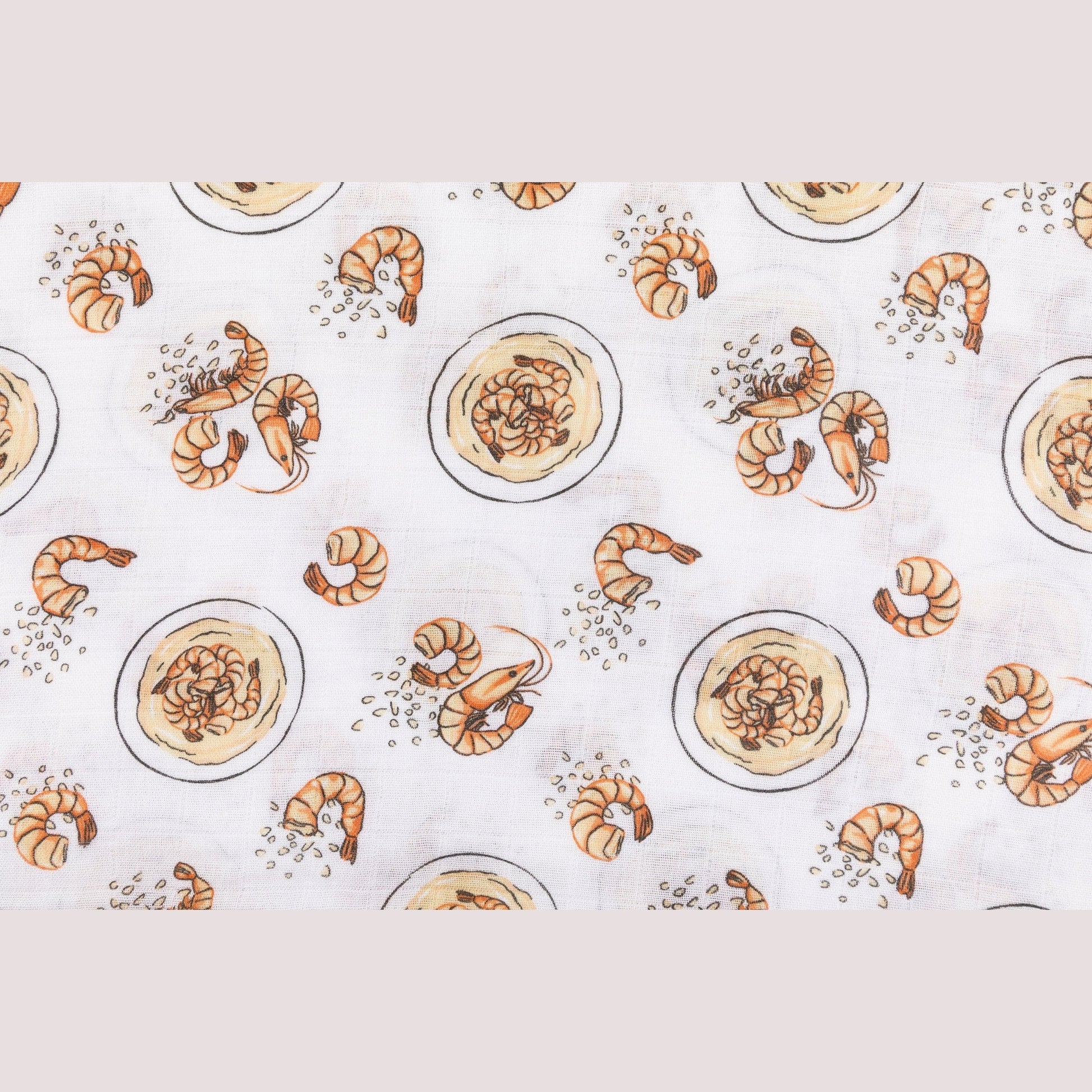 White muslin swaddle blanket with colorful shrimp and grits pattern, featuring bowls, shrimp, and corn.