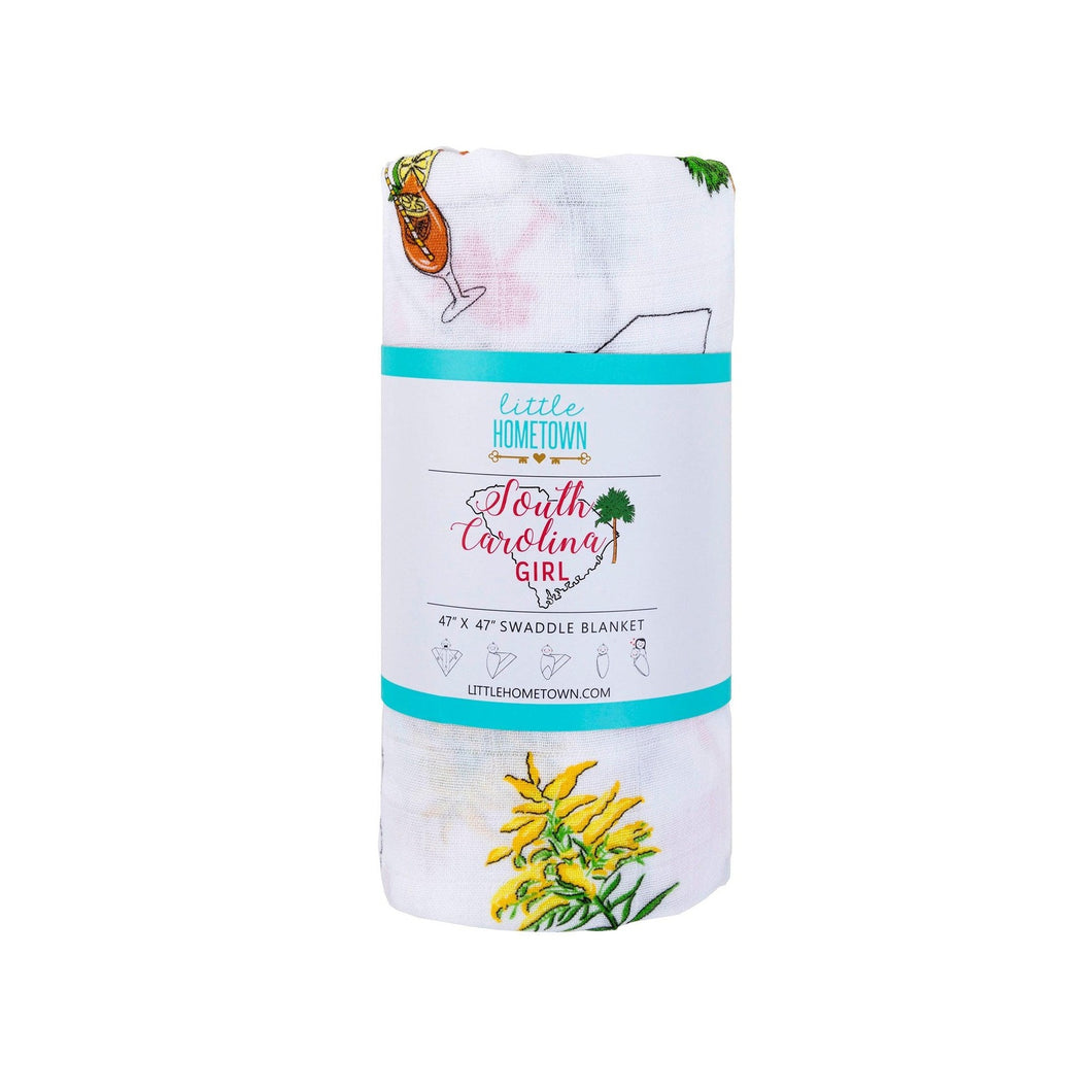 White muslin swaddle blanket with 