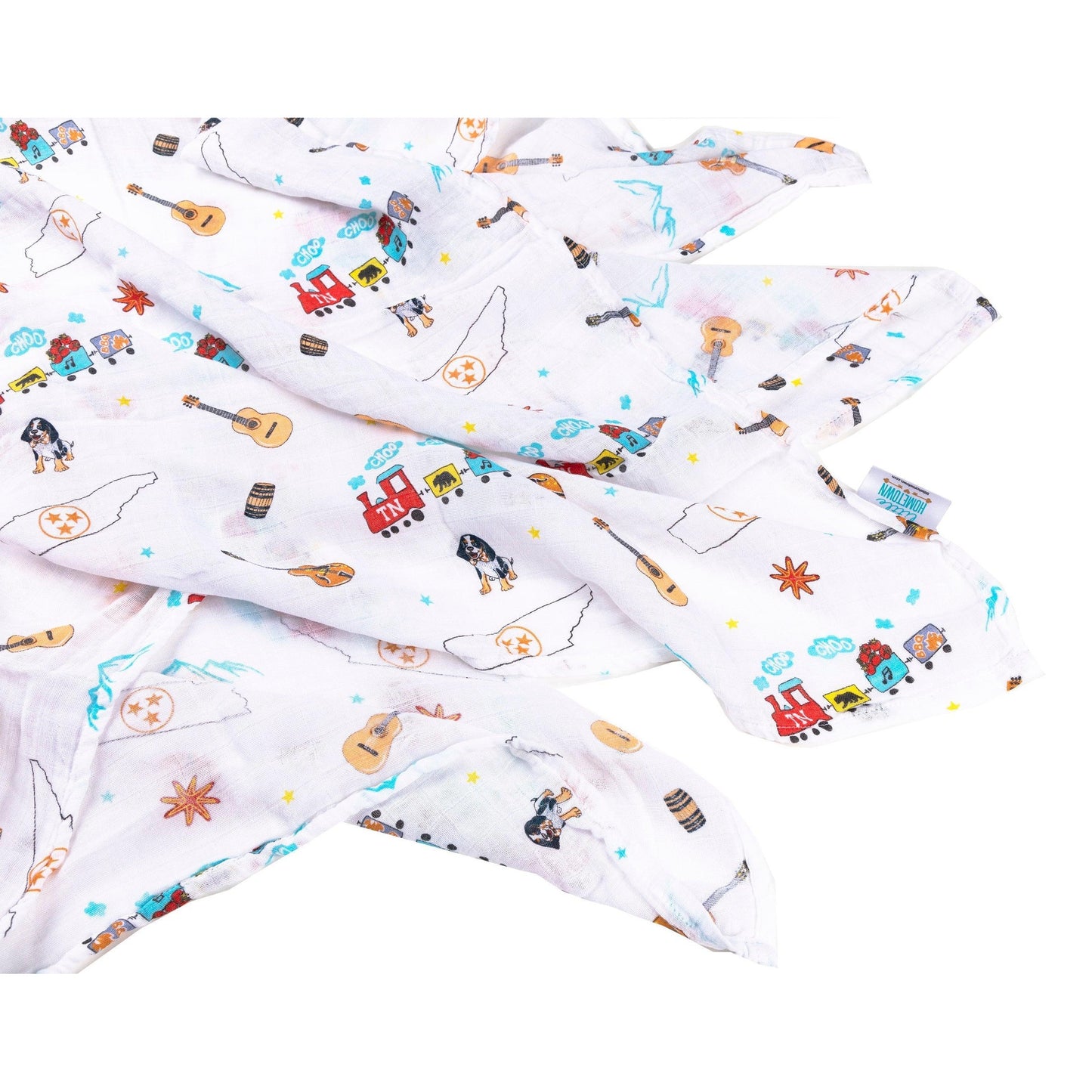 White muslin swaddle blanket with Tennessee state map, featuring landmarks, animals, and "Tennessee" text in blue.