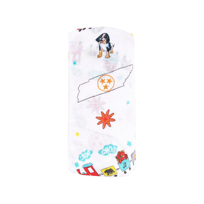 Tennessee-themed baby muslin swaddle blanket with state icons like guitars, horses, and musical notes in soft pastel colors.