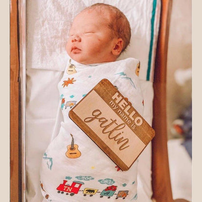 Tennessee-themed baby muslin swaddle blanket featuring state icons like guitars, horses, and musical notes.