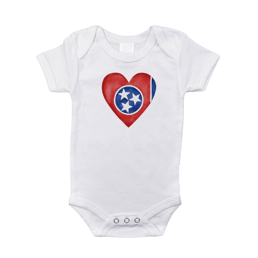 White baby onesie with a red heart and 
